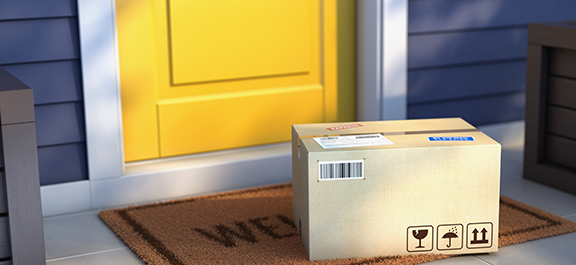 Package at doorstep in front of yellow door on blue house