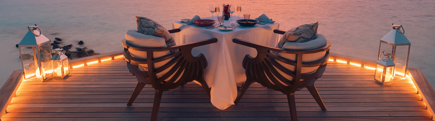 beautiful outdoor table setting at sunset oceanside